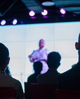 individual speaking to audience