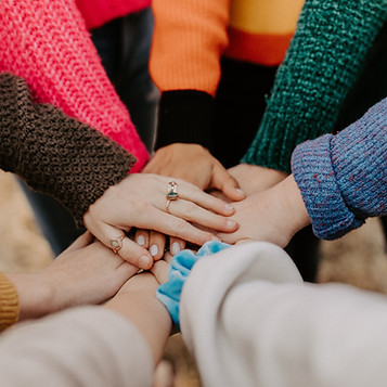 image of hands in a circle
